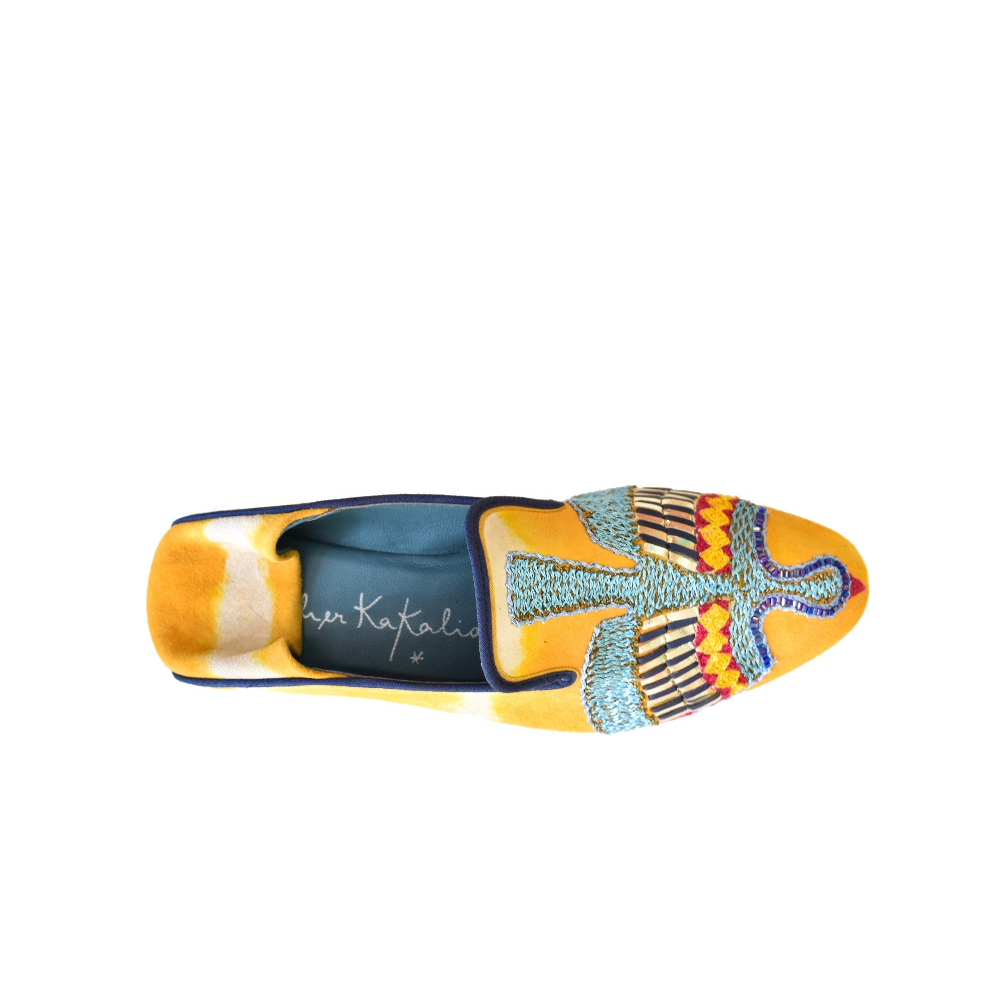 Top view of Meher Kakalia ANZU Moccasin in saffron yellow tie-dye suede with blue hand embroidery and Mukesh metallic detail