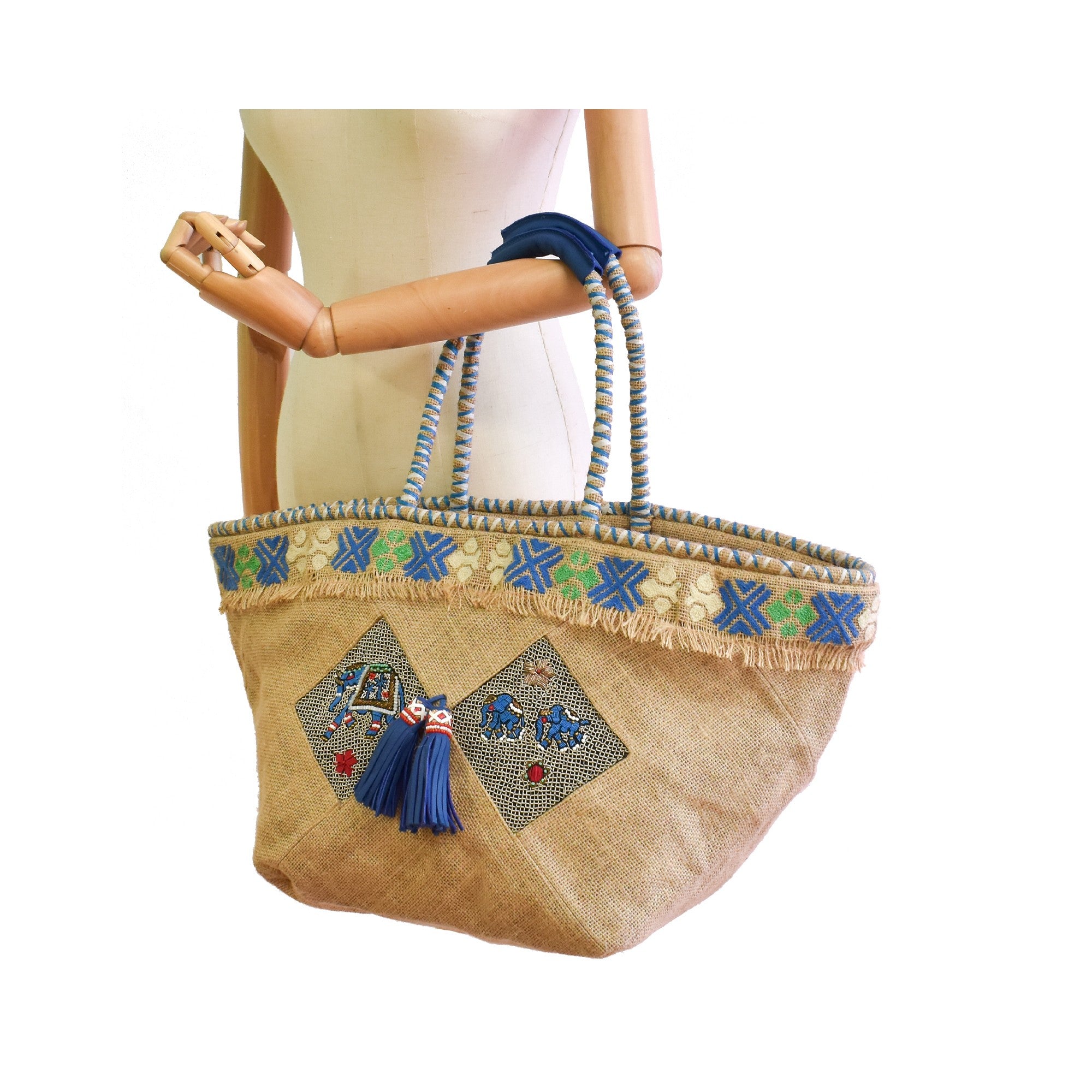 Embroidered jute beach bag with braided handles and leather grip