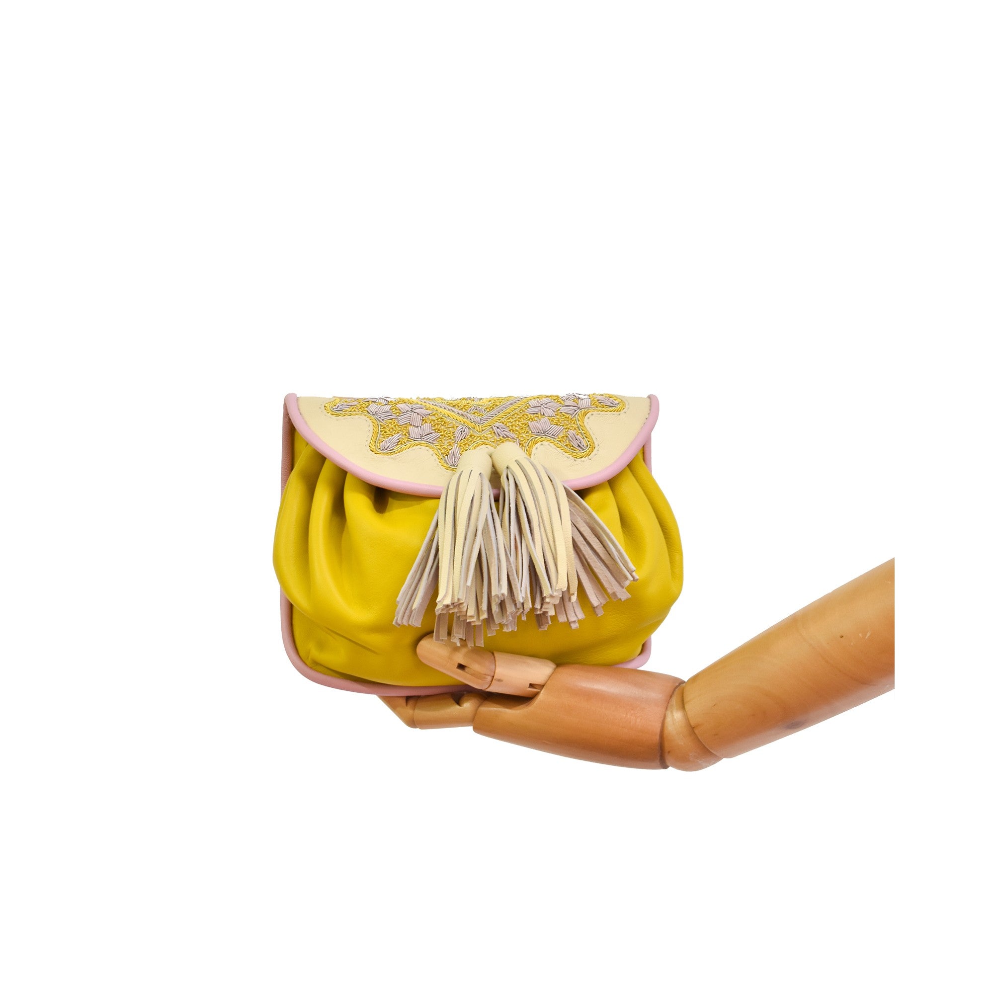 Women’s leather waist bag in bright yellow with artisan hand embroidery.