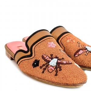 Sustainable embroidered flats with vibrant floral details, ideal for warm weather and casual outfits.