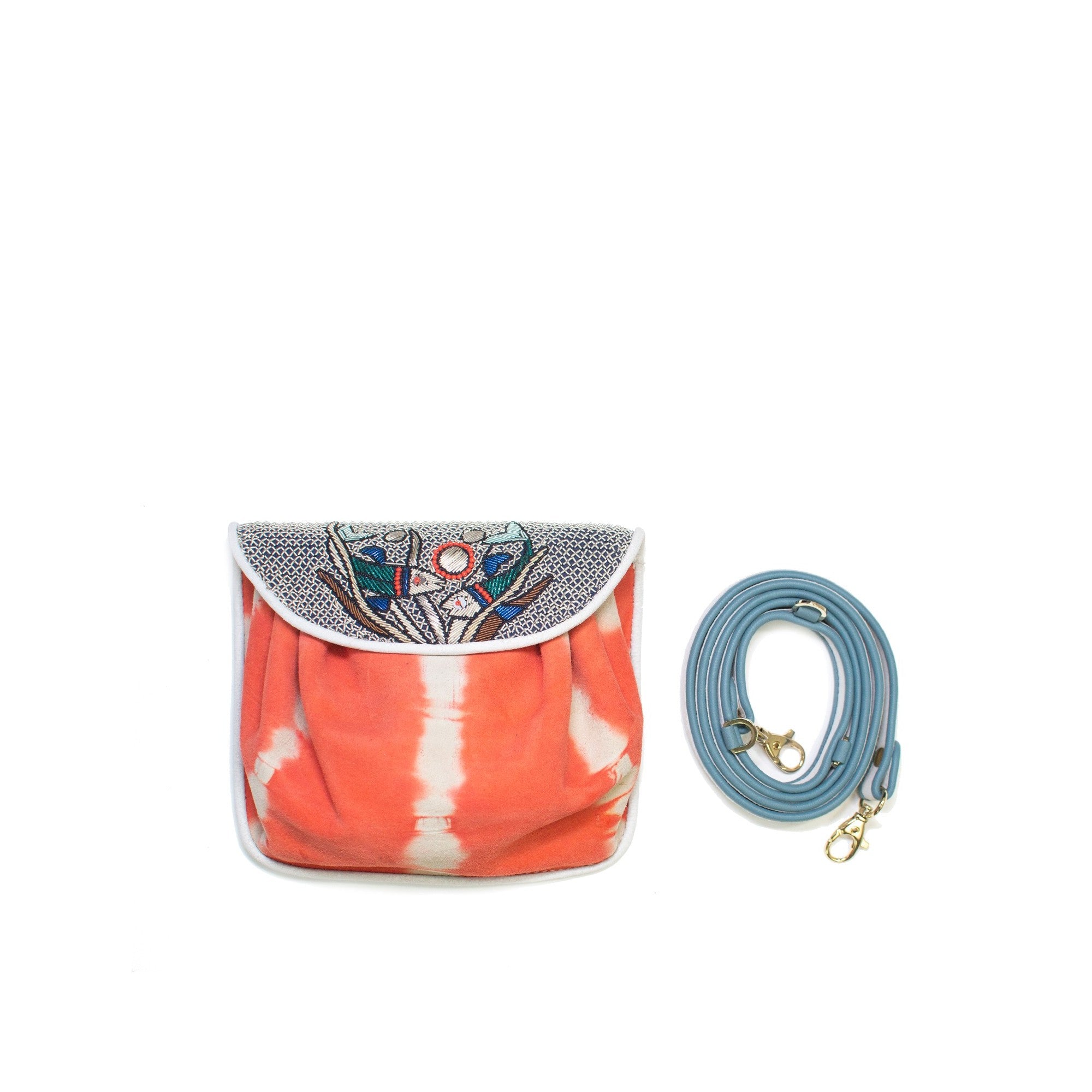 Meher Kakalia Fiji Accordion Bag in orange tie-dye suede with embroidered dapka fish motif, featuring a blue leather strap.