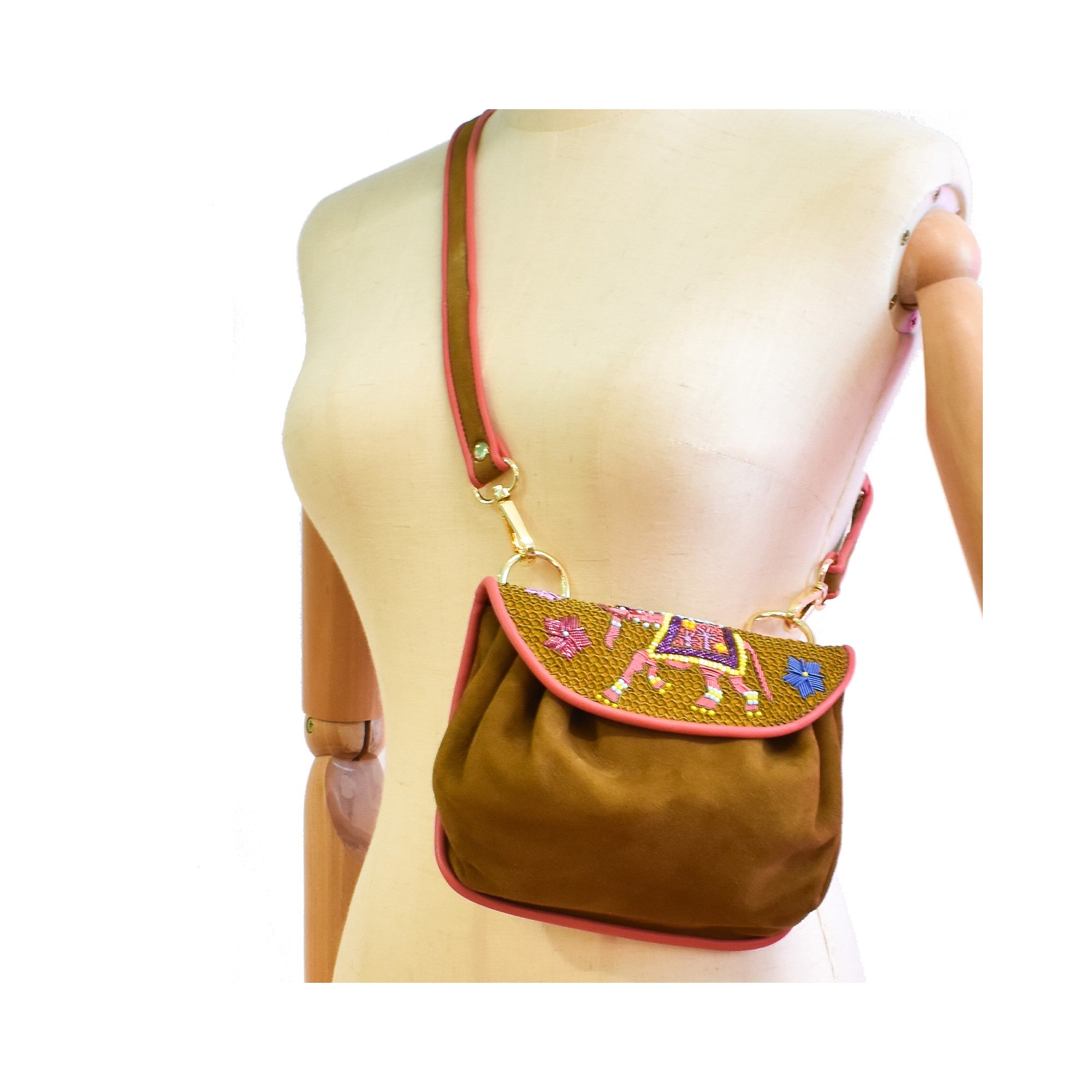 Brown suede crossbody bag with traditional coil embroidery and elephant motif.