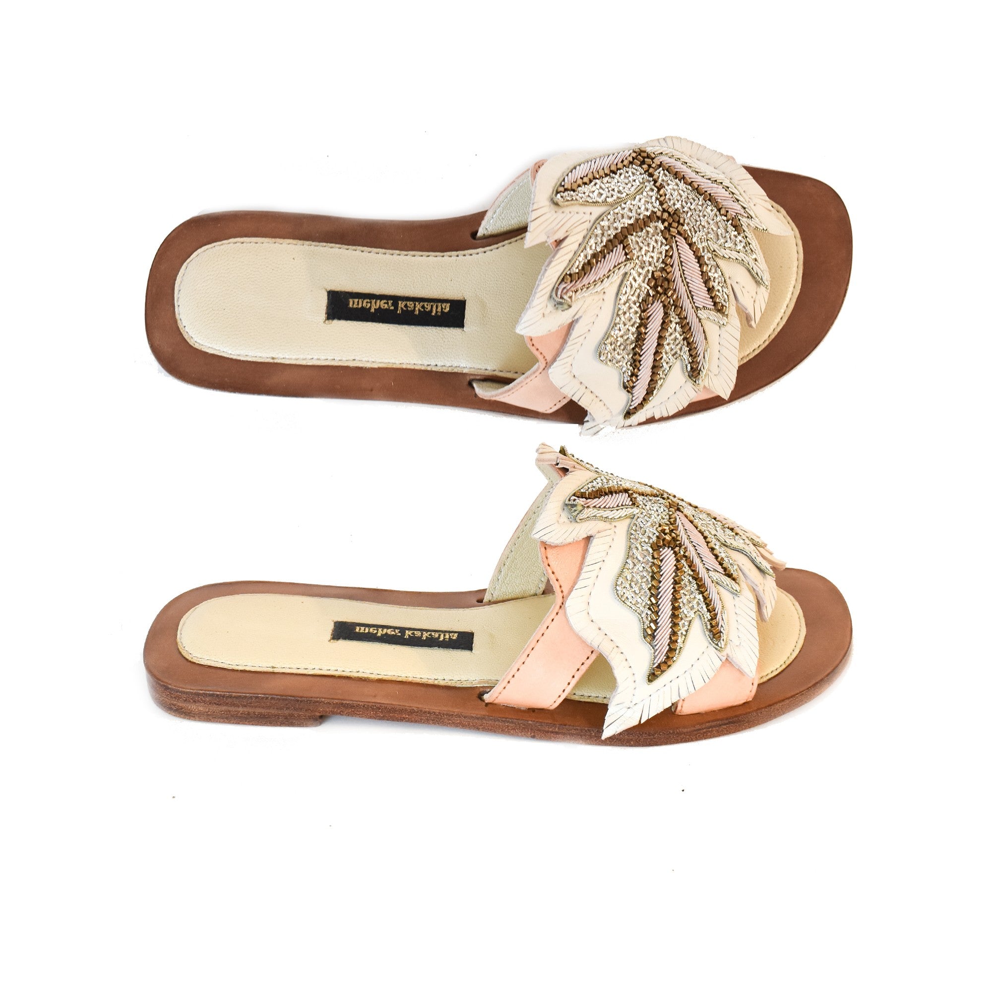 Handmade Palm Gobi Slide white with intricate palm leaf embroidery. Elegant resort footwear for summer vacations.