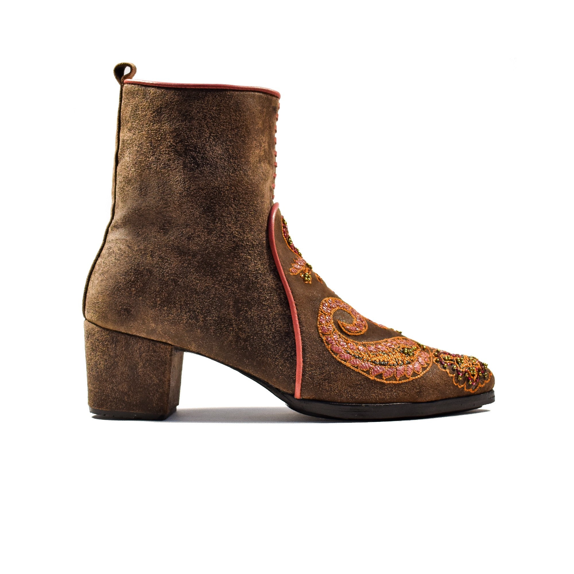 Beaten brown suede ankle boots with hand-embroidered paisley motifs in gold and green, by Meher Kakalia.