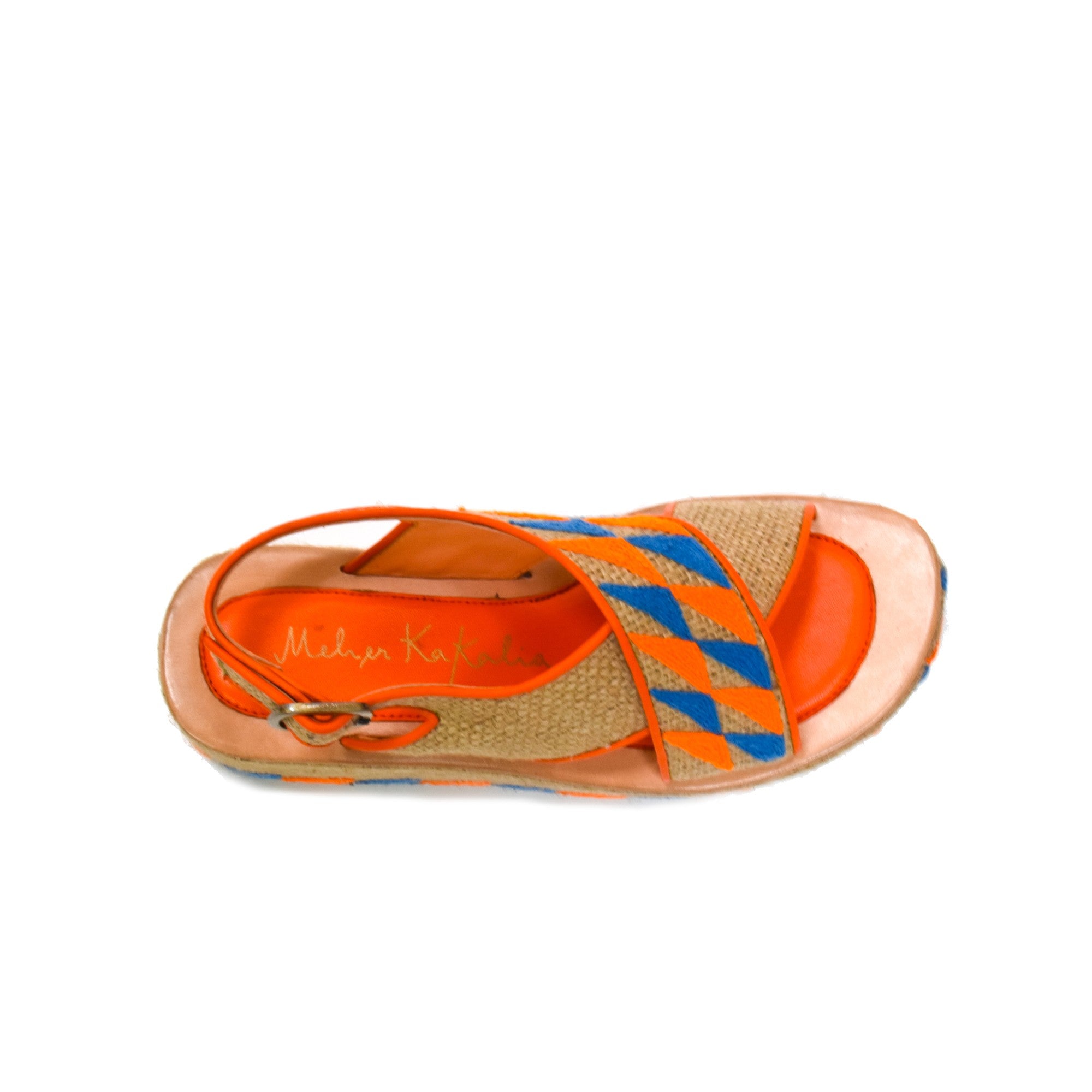 Top-down view of Ponza Geo Bloc wedges, showcasing the cushioned insole, orange lining, and hand-embroidered details.