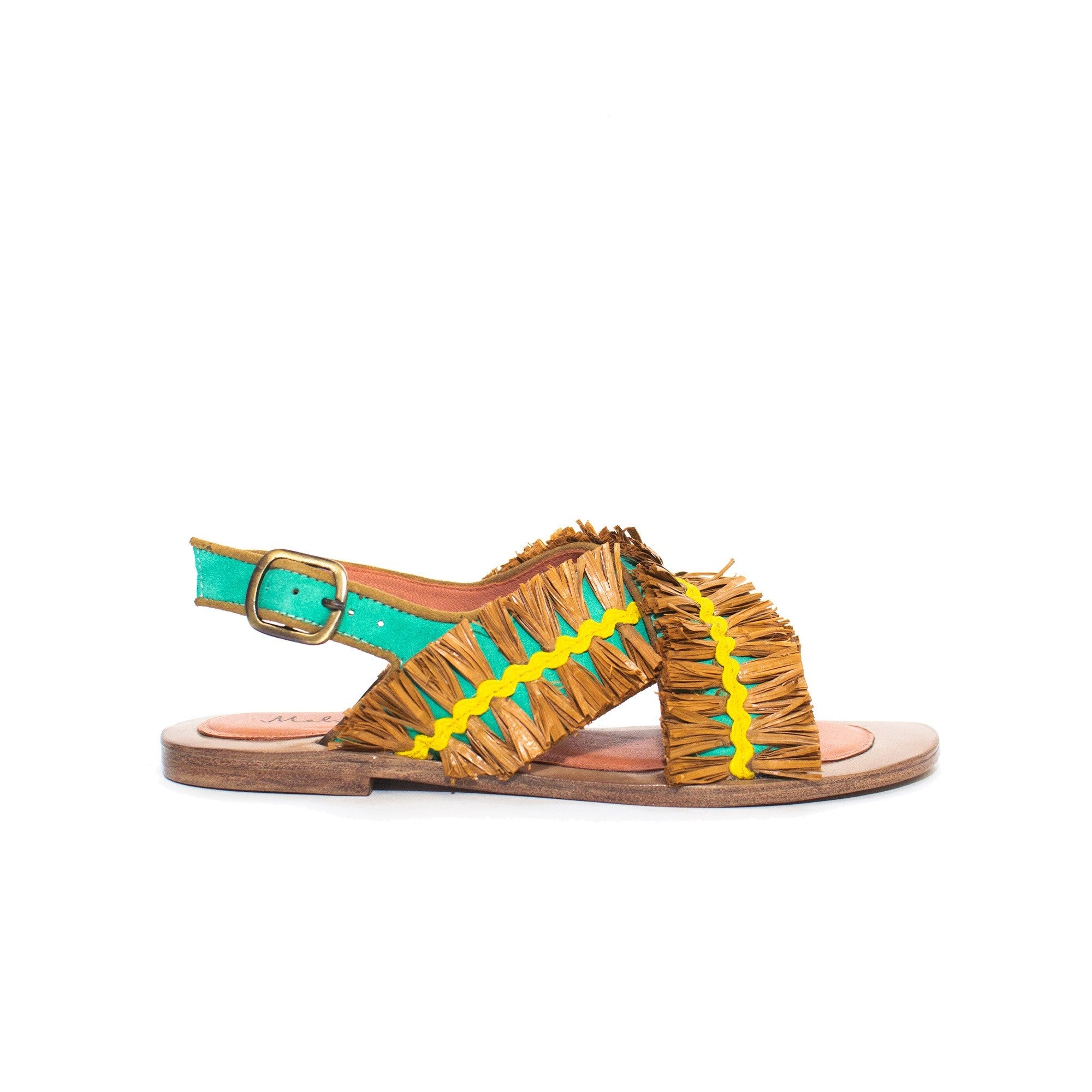 Side view of PONZA LIKU sandal with crossover raffia straps and gold buckle.