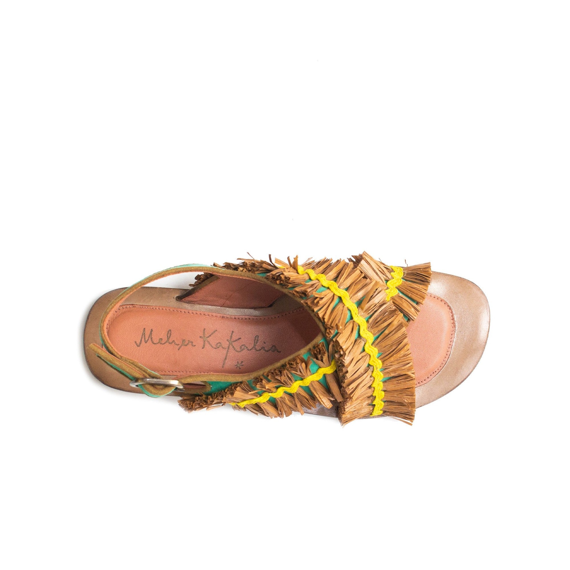 Top-down view of artisan-made summer sandals with colourful raffia texture.