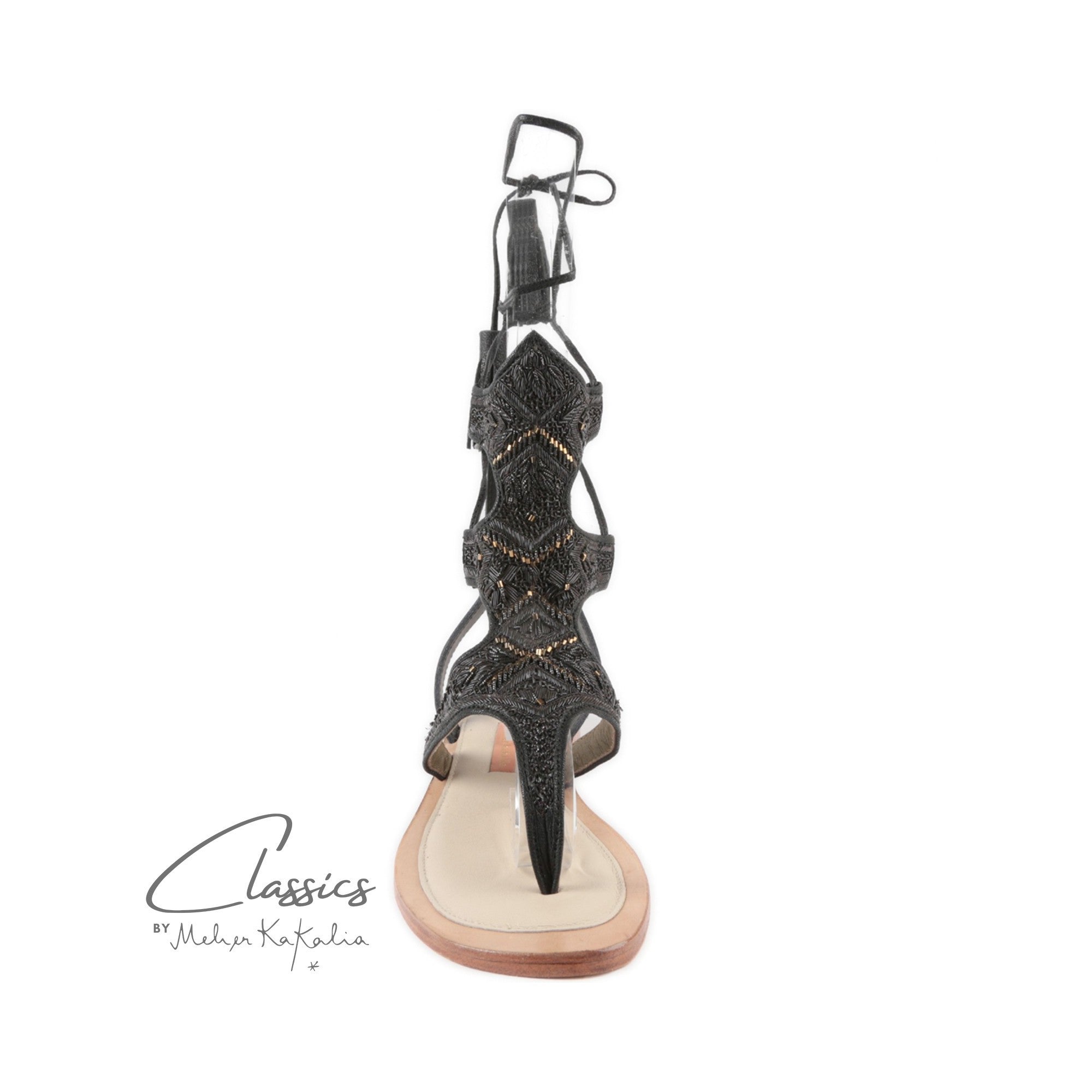 Eco-friendly Clio sandals, embroidered for a stylish, sustainable resort evening look.
