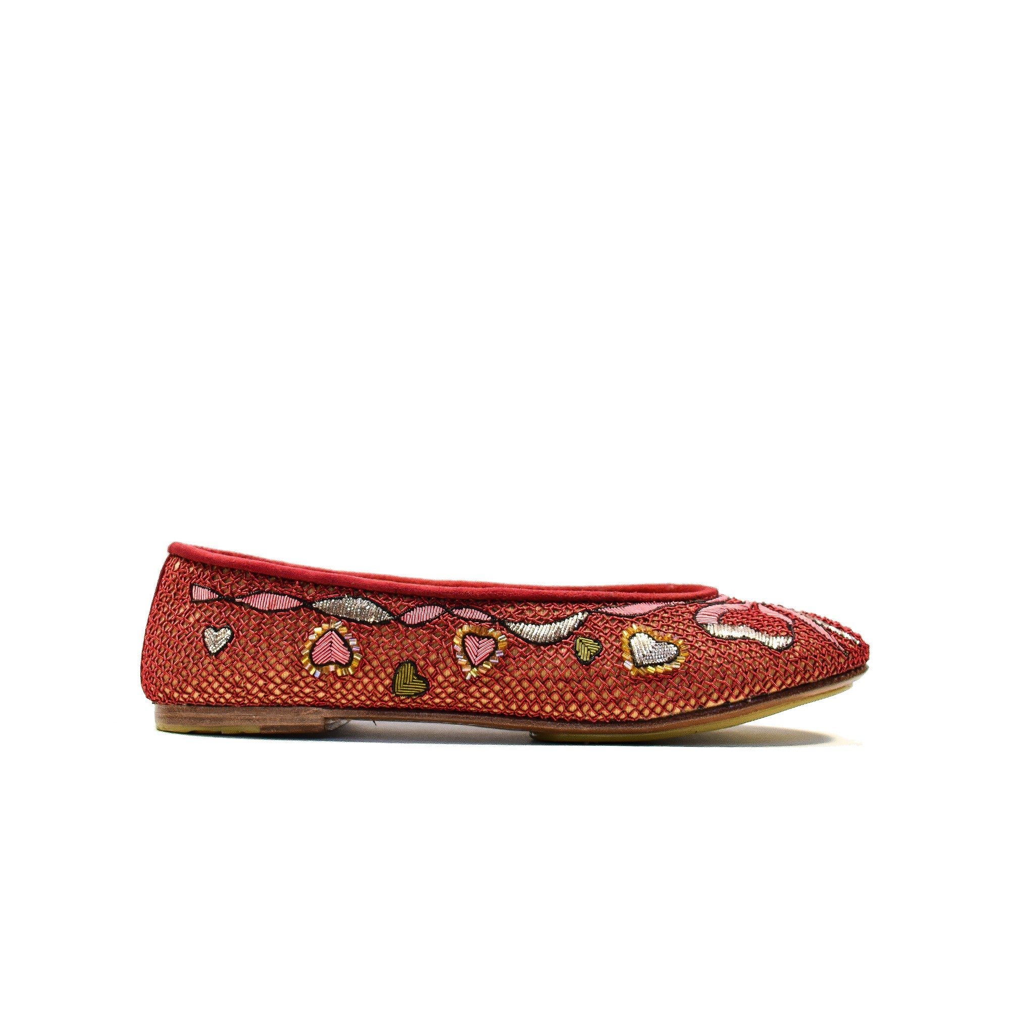 Handmade ballet flats with a romantic heart design, offering a unique and elegant touch.